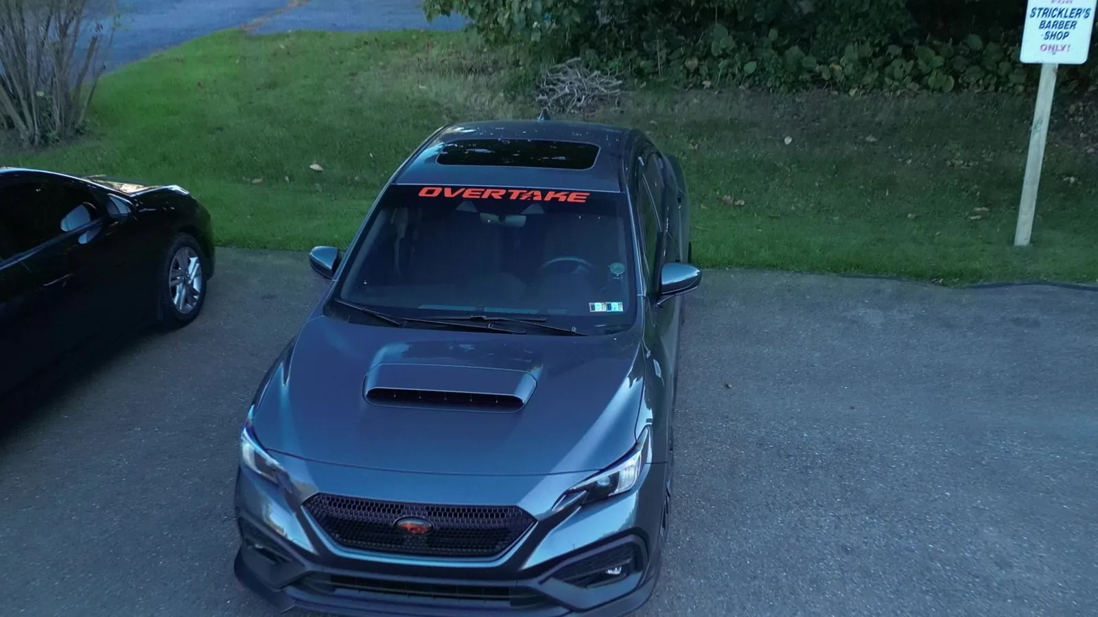 Drone shot of the front with the Overtake windshield banner