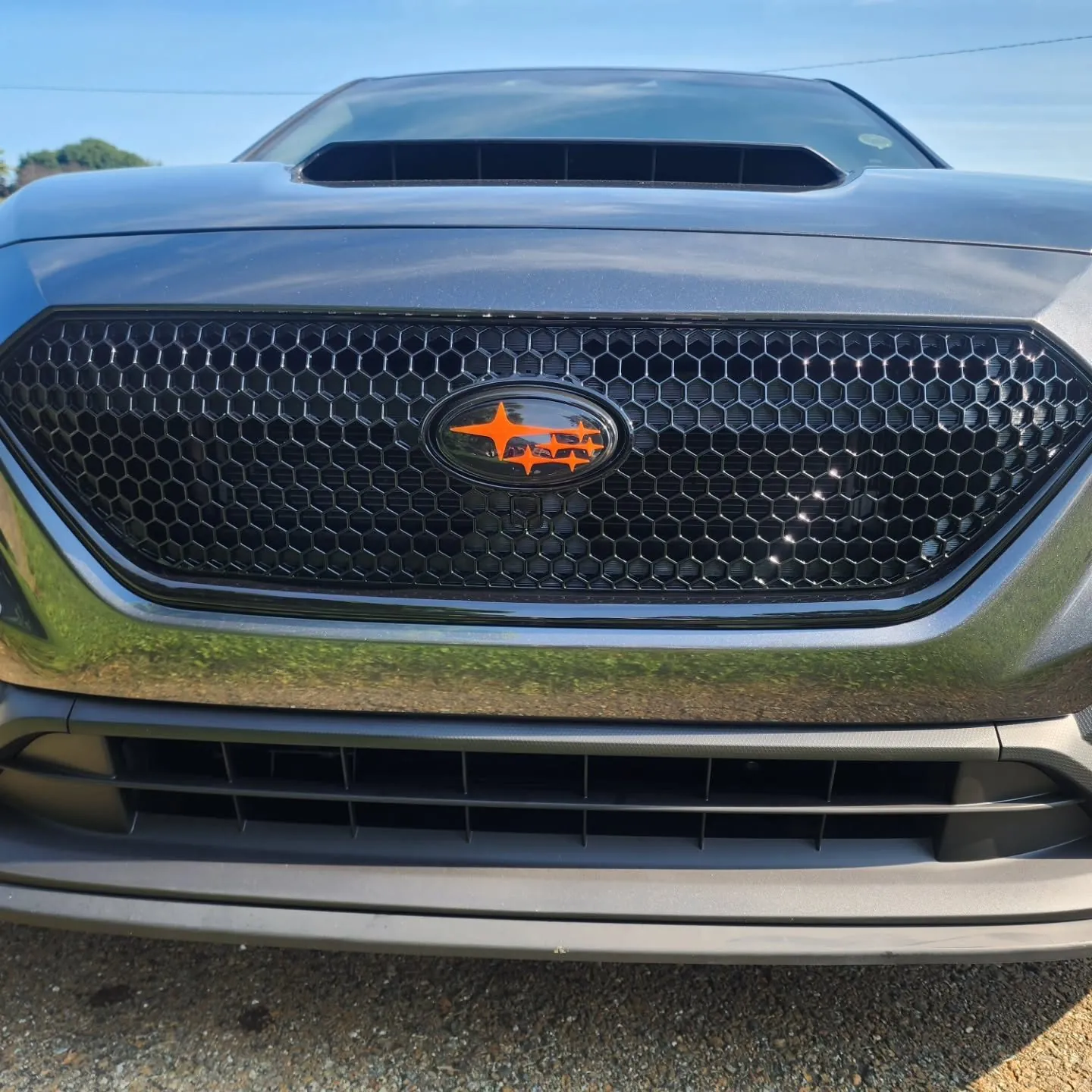 Grille and orange badge
