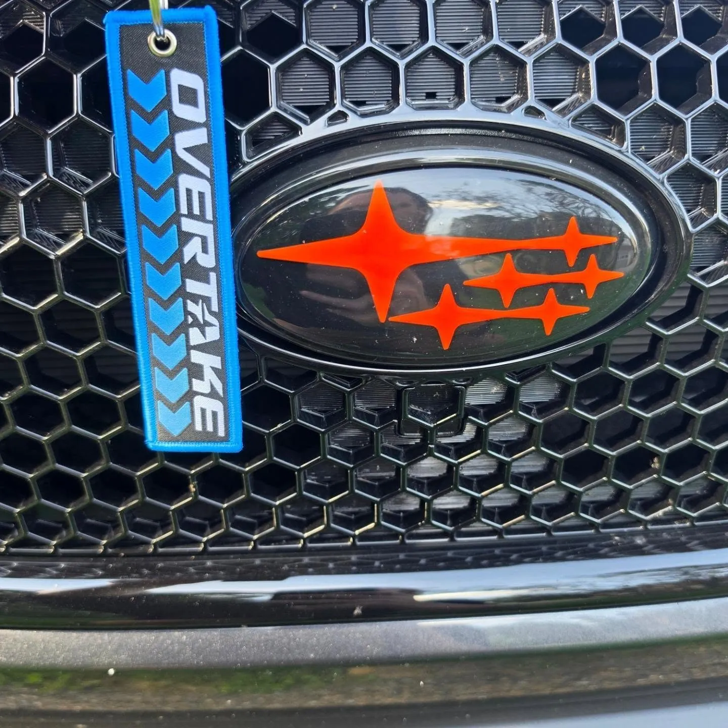 Overtake Sponsored Driver tag on the grille