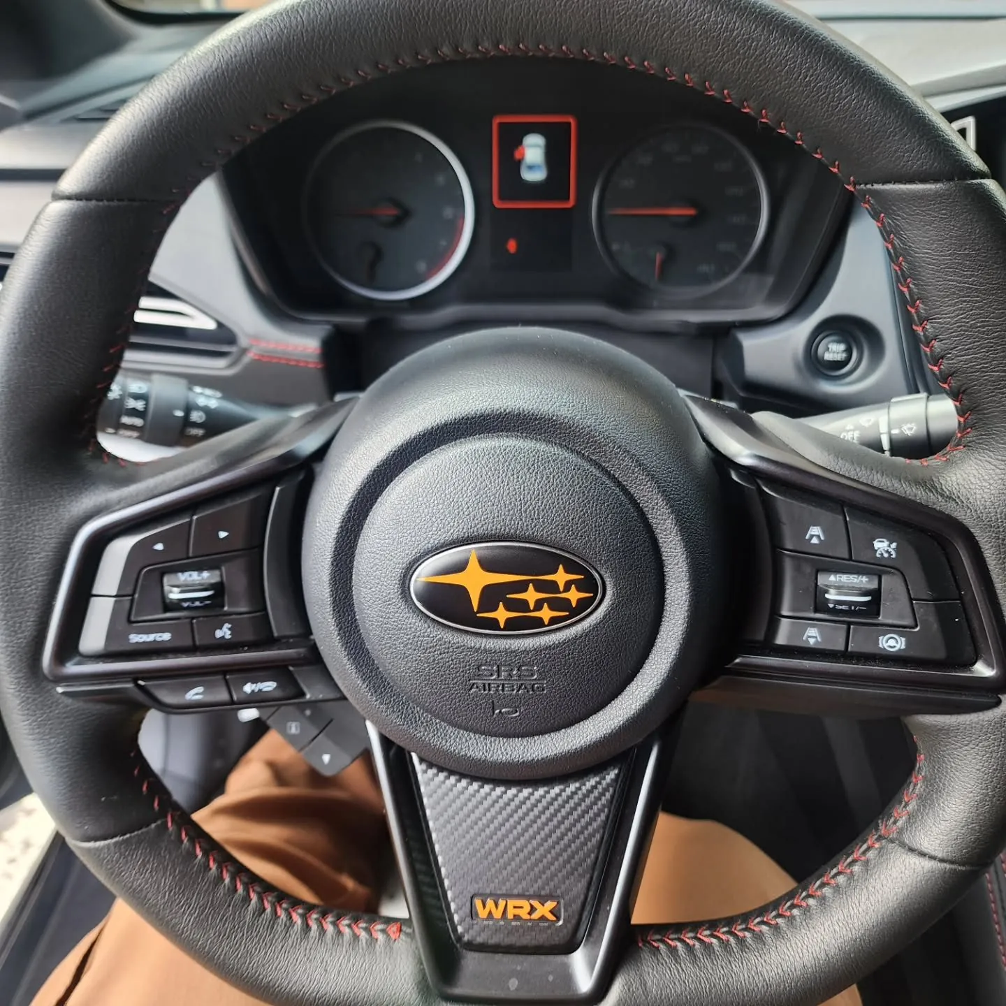 Orange steering wheel badge
