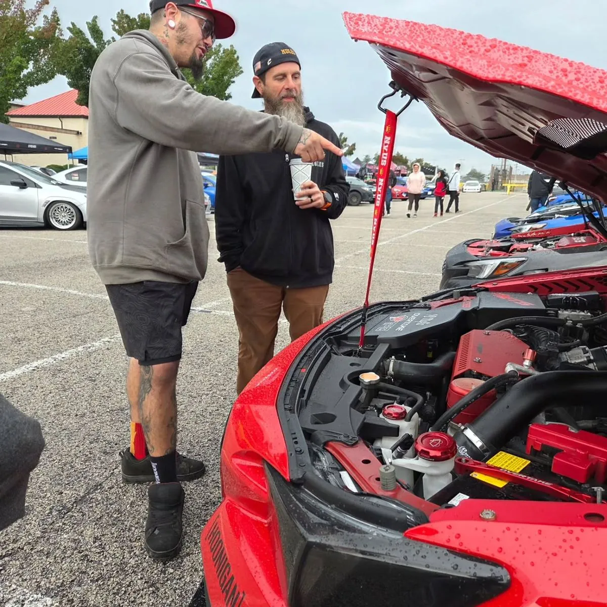 Talking shop over an open hood