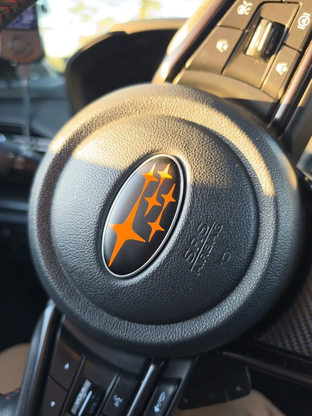 Orange stars on the steering wheel