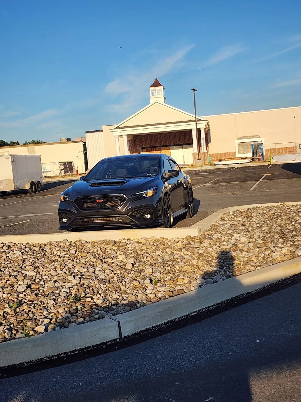 Parked out front under a blue sky