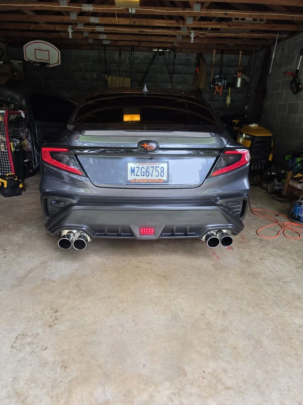 Rear in the garage with the door open