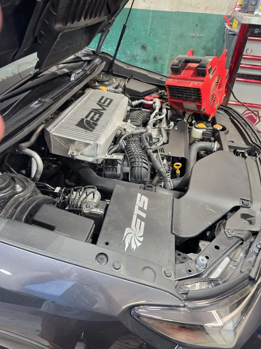 Bay finished, hood up at the shop