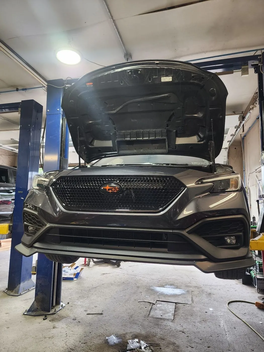 Front on the lift, hood up