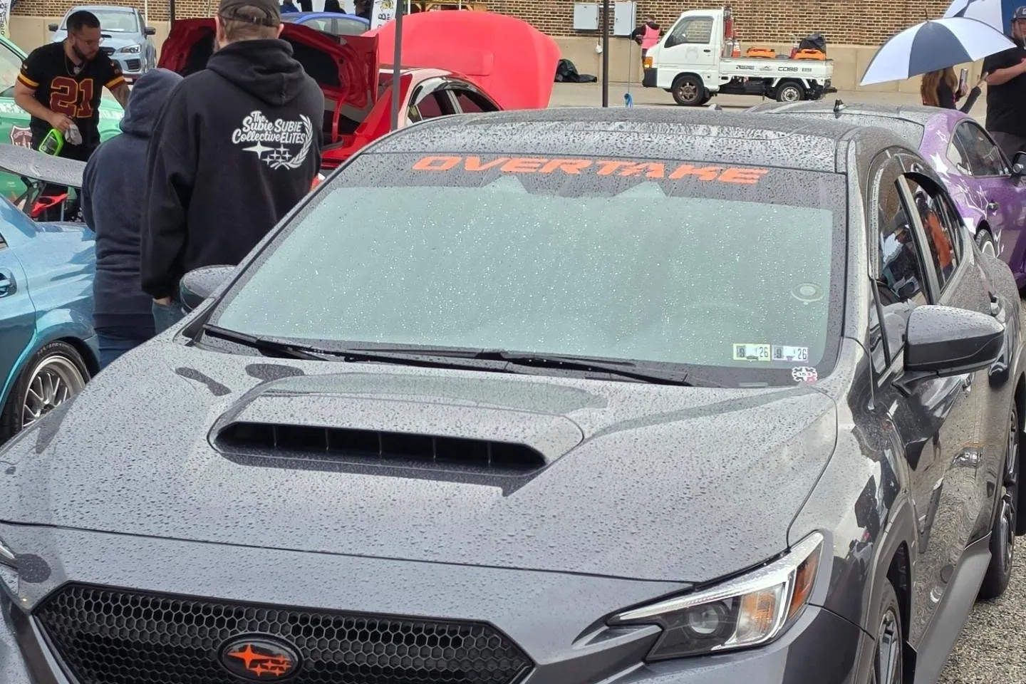 Fenrir at Boxerfest under the Overtake windshield banner