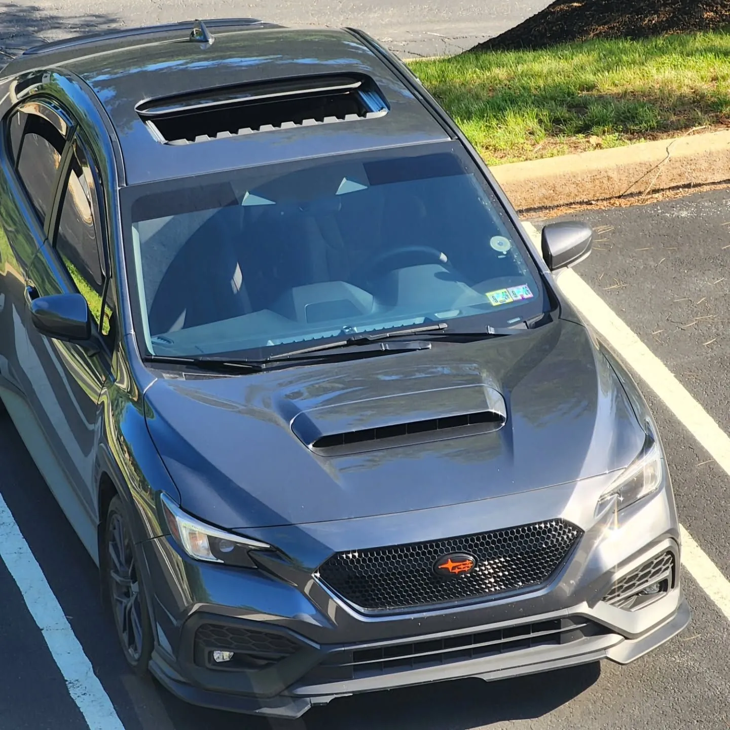 High front three-quarter showing the hood scoop