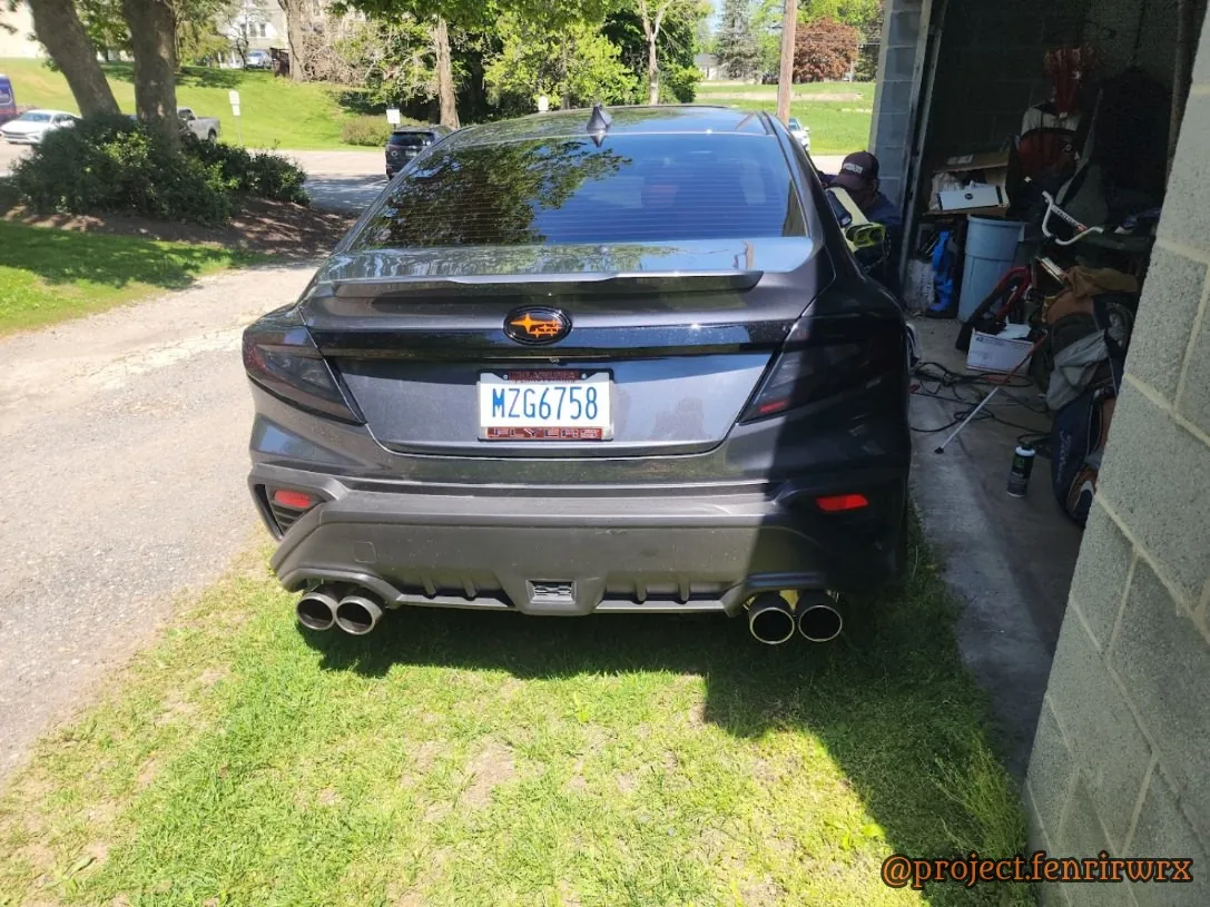 Smoked taillights and the orange rear badge