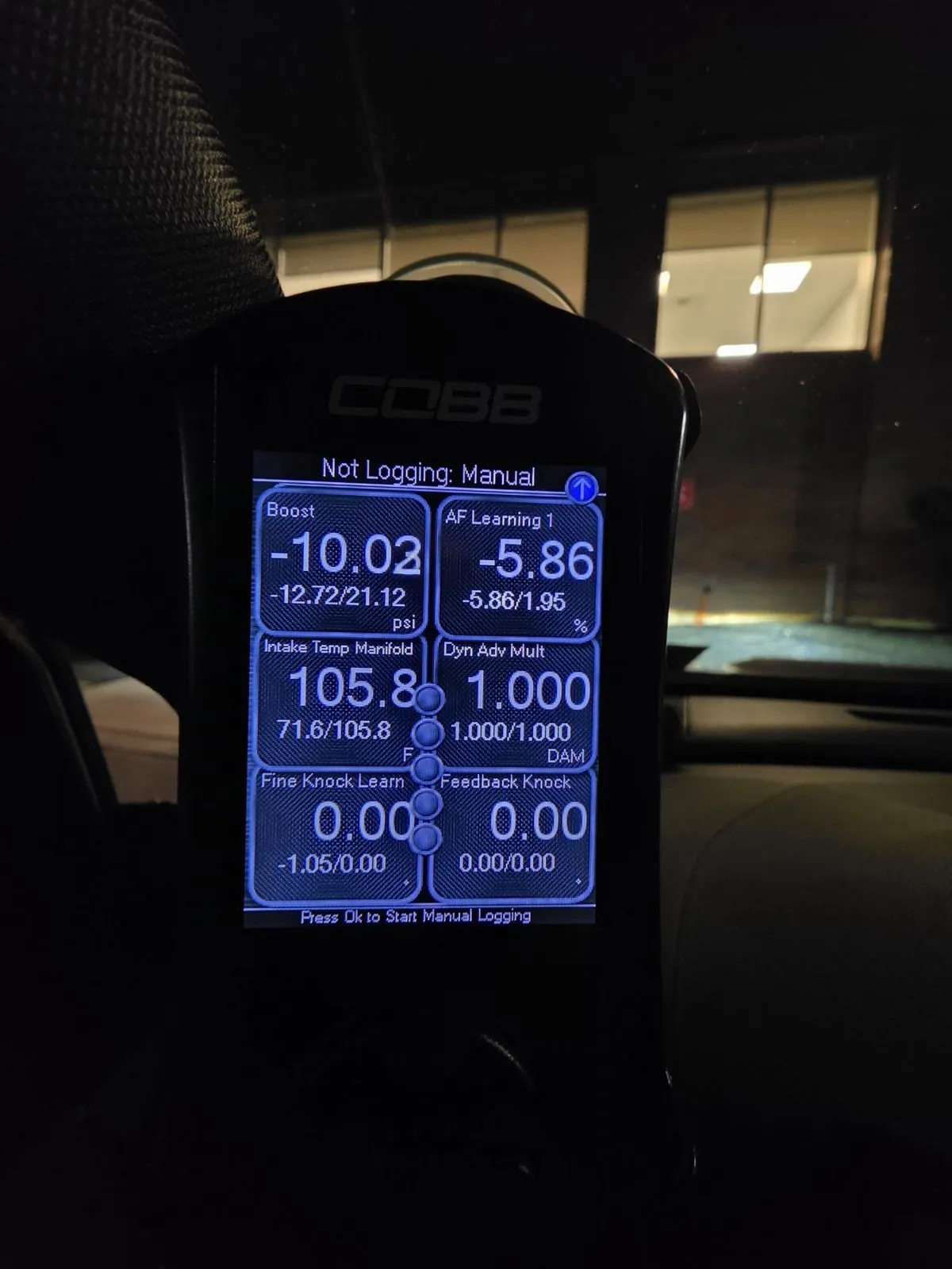 COBB Accessport V3 at night showing a 21.12 psi boost peak