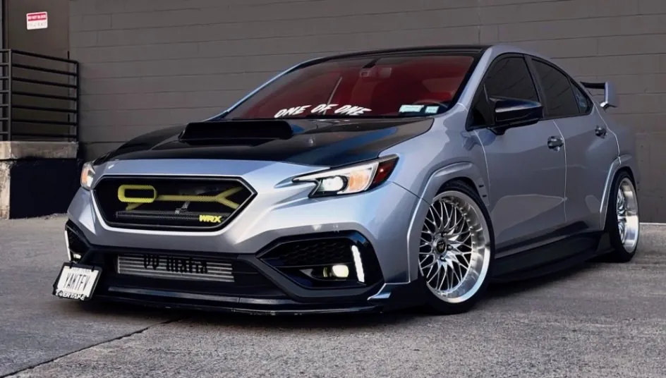 @6spdvb's WRX front three quarter against a gray wall