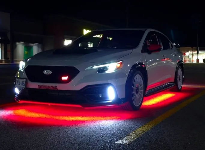 @whitecherrywrx's WRX at night with red underglow